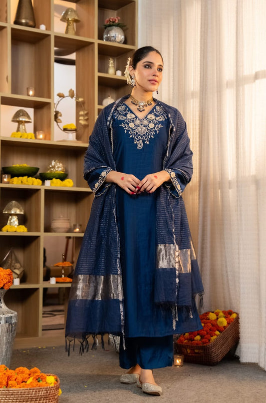 The pure Satori silk kurta is adorned with intricate machine embroidery and delicate handwork