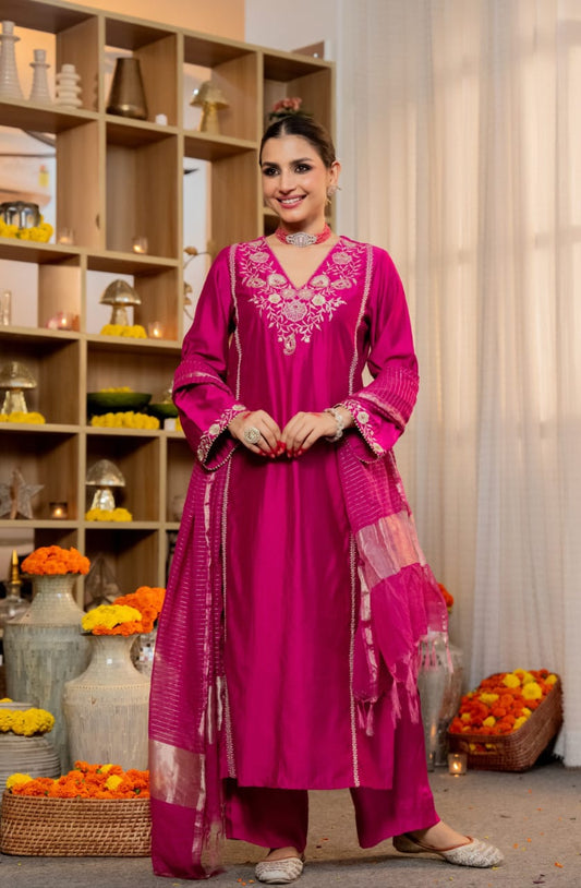 The pure Satori silk kurta is adorned with intricate machine embroidery and delicate handwork